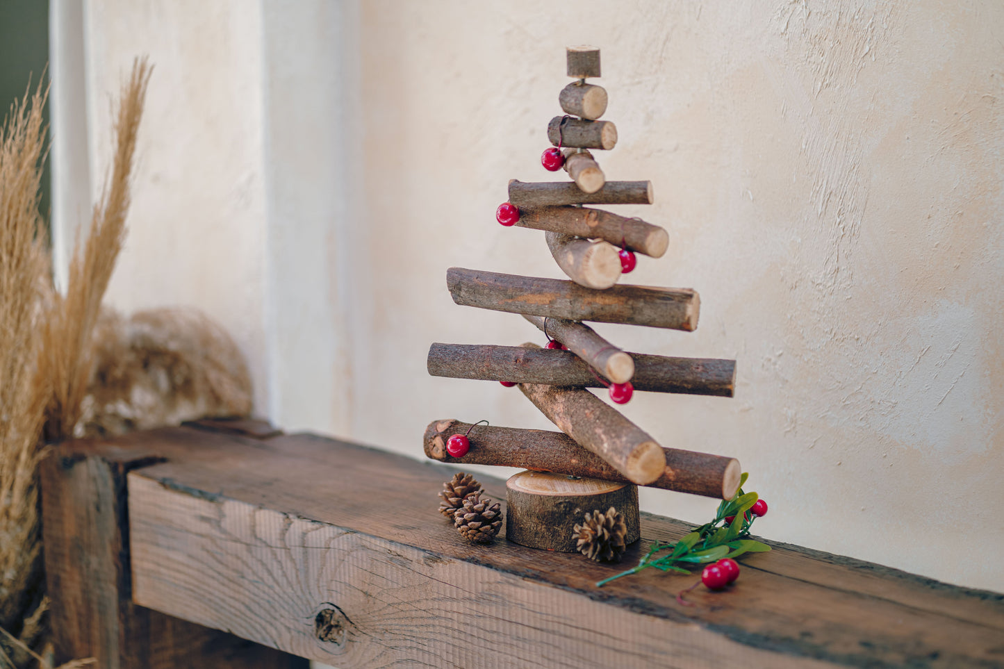 Wooden Christmas tree decoration on a rustic wooden surface with a neutral background