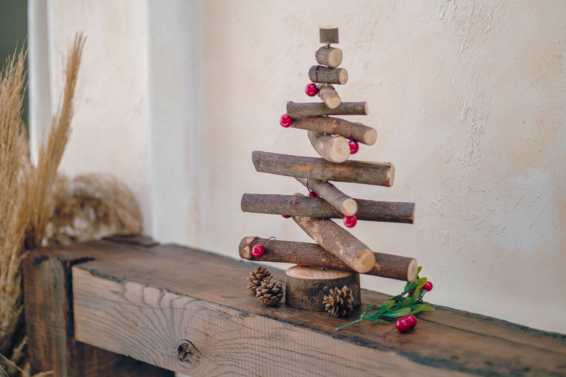 Wooden Christmas tree decoration on a rustic wooden surface with a neutral background